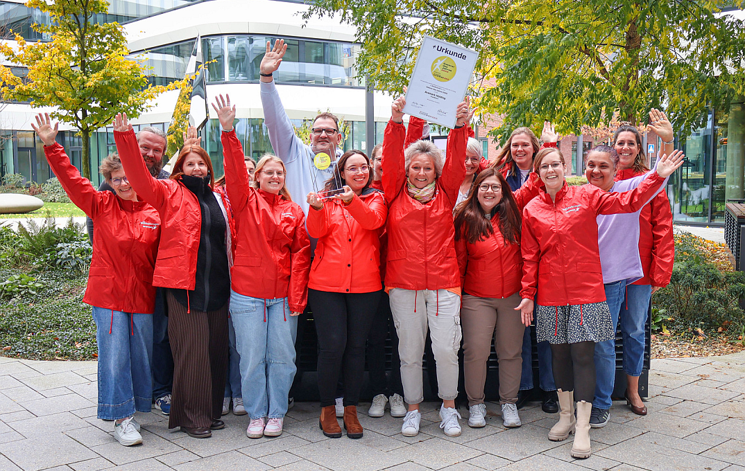 a group of employees with the award